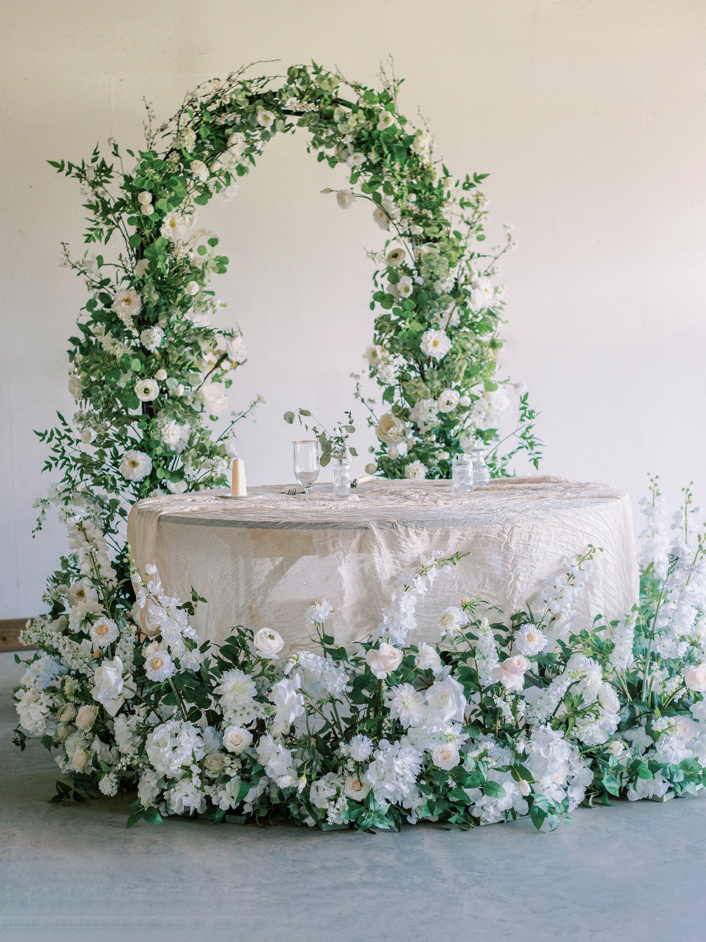 Sweetheart Table with white flower arch