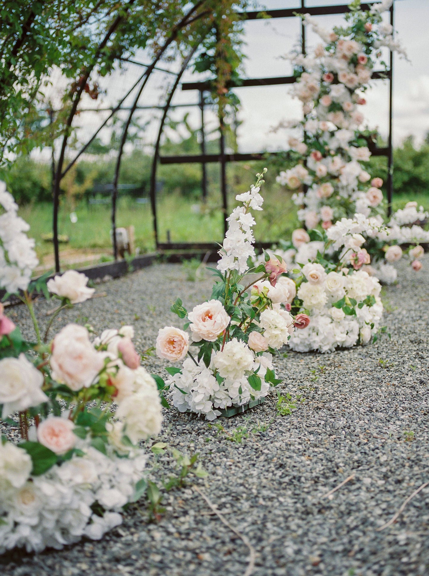 Ceremony lush aisle flowers
